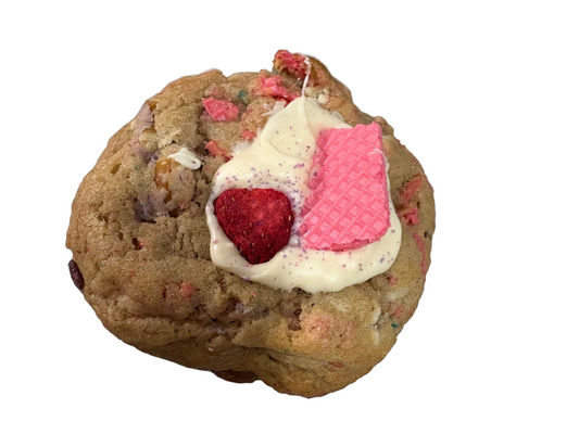 Cookie with cream, raspberry, and pink wafer on a white background